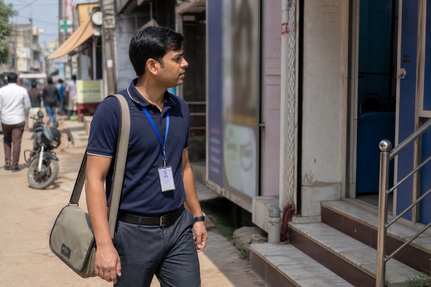 A medical representative walking toward a clinic after a day of field visits